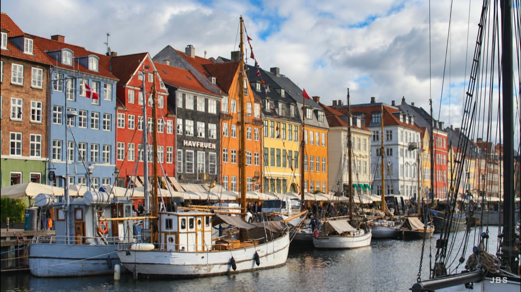 Boats moored along Nyhavn's colorful waterfront in Copenhagen