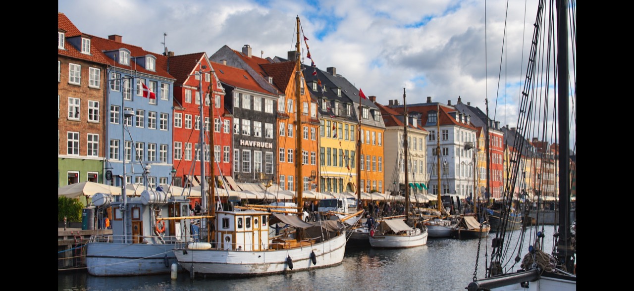 Boats moored along Nyhavn's colorful waterfront in Copenhagen