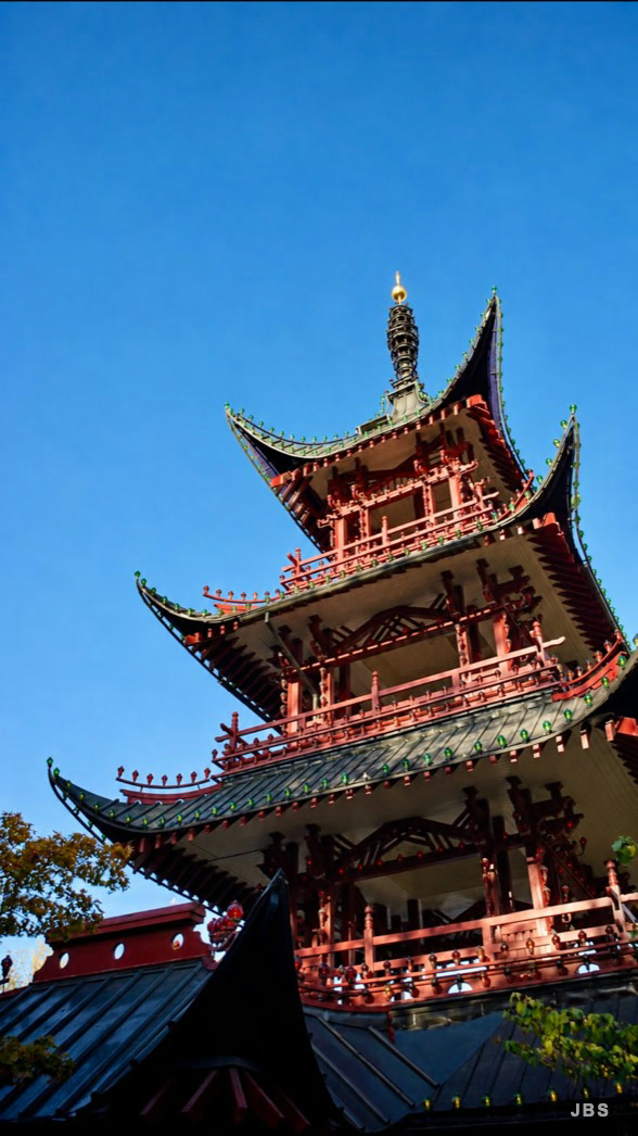 An ornate pagoda rising into a clear blue sky